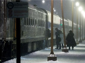 The AMT 25 train to the Dorion-Rigaud area has cars recently leased from New Jersey Transit. Passengers make their way through the snow at the Lucien-L'Allier Train Station in Montreal on Wednesday, January 7, 2009. (THE GAZETTE/Dave Sidaway)