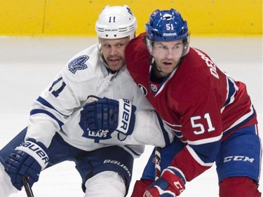 Toronto Maple Leafs' Olli Jokinen gets up close to Montreal Canadiens' David Desharnais during second period NHL hockey action Saturday, February 28, 2015 in Montreal.