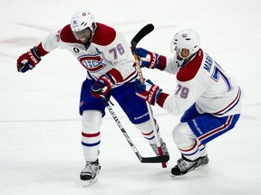 Montreal Canadiens defenceman Andrei Markov helps teammate P.K. Subban off the ice as play continues during second period NHL action Wednesday February 18, 2015 in Ottawa. Subban headed to the bench after blocking a shot during the second period.