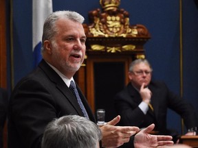 Quebec Premier Philippe Couillard responds to the Opposition during question period Feb. 12, 2015 at the National Assembly in Quebec City.