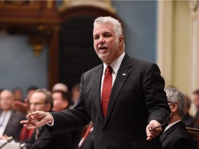 Quebec Premier Philippe Couillard responds to the Opposition during question period. Wednesday, February 25, 2015 at the legislature in Quebec City. A CROP survey conducted for La Presse suggest the Quebec Liberals have dropped eight points in popularity.