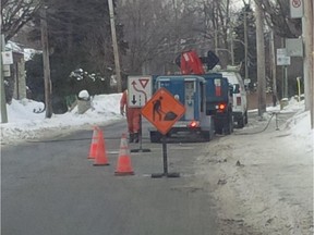 Pointe-Claire public works vehicles at the corner of Bord du Lac and Jasper Ave. in Pointe-Claire. Crews are still trying to restore water service. Several nearby residents have been without water since Feb. 19, 2015.