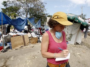 Gazette reporter Sue Montgomery at work in Port-au-Prince, Haiti, Sunday  January 17, 2010, days after a magnitude 7 earthquake hit the country.
