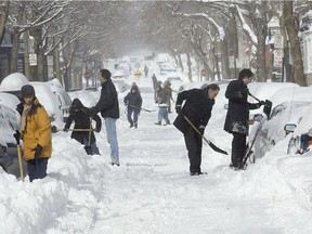 Montreal Gazette files: Residents of St-André in the Plateau, shovel their car from the snowbanks on March 09, 2008.