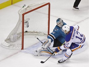 Edmonton Oilers' Rob Klinkhammer scores the winning goal past San Jose Sharks goalie Antti Niemi during a shootout of game on Feb. 2, 2015, in San Jose, Calif. Edmonton won the game 5-4.