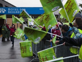 In this file picture from 2010, protesters from the common front of Quebec's 475,000 public-sector employees gathered outside the Hotel des Seigneurs where a general council meeting was taking place in Saint Hyacinthe. Five years later, as springtime negotiations begin in a climate of government austerity, are Quebecers in for an autumn of labour strife?