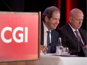 CGI chairman Serge Godin, left, and chief executive Michael Roach get set to start the company's annual meeting Wednesday, Jan. 28, 2015 in Montreal.