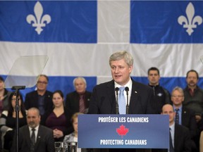 Prime Minister Stephen Harper addresses families of victims of repeat violent offenders, Thursday, February 12, 2015 in Victoriaville, Que.