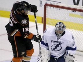 Tampa Bay Lightning goalie Ben Bishop blocks a shot by the Anaheim Ducks' Devante Smith-Pelly during game in Anaheim, Calif., on Feb. 18, 2015.