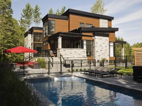 The 14,000-square-foot lot has ample room for a  pool which was installed on the side of the house which faces east. The lounging area is at the rear of the house.