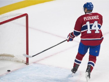 Montreal Canadiens' Tomas Plekanec scores on an empty net during third period NHL hockey action against the Columbus Blue Jackets in Montreal, Saturday, February 21, 2015.