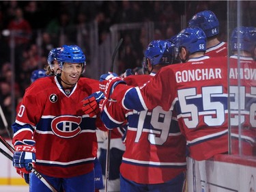Manny Malhotra #20 of the Montreal Canadiens celebrates his first period goal with teammates during during an NHL game at the Bell Centre on Feb. 28, 2015 in Montreal, Quebec, Canada.