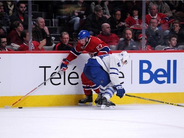 Alex Galchenyuk #27 of the Montreal Canadiens moves the puck past Morgan Rielly #44 of the Toronto Maple Leafs during during an NHL game at the Bell Centre on Feb. 28, 2015 in Montreal, Quebec, Canada.