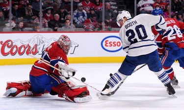 Carey Price #31 of the Montreal Canadiens makes a stick save on the puck in front of David Booth #20 of the Toronto Maple Leafs during during an NHL game at the Bell Centre on Feb. 28, 2015 in Montreal.