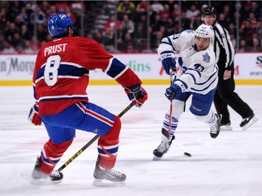 Nazem Kadri #43 of the Toronto Maple Leafs shoots the puck in front of Brandon Prust #8 of the Montreal Canadiens during an NHL game at the Bell Centre on Feb. 28, 2015 in Montreal.
