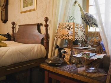 Various collectibles adorn a bedside table in one of the bedrooms on the upstairs floor.