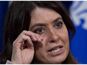 Quebec Opposition MNA Veronique Hivon gets emotional as she reacts to the Supreme Court judgement on medically assisted suicide, Friday, February 6, 2015 at the legislature in Quebec City. Hivon lead the way to the Quebec legislation allowing medically assisted suicide.