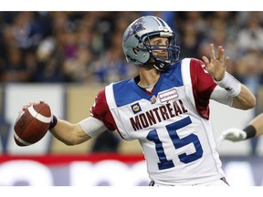 Montreal Alouettes' quarterback Alex Brink (15) throws during the first half of CFL action against the Winnipeg Blue Bombers in Winnipeg Friday, August 22, 2014.