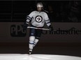 Evander Kane of the Winnipeg Jets skates on ice during player introductions before game against the Penguins at Pittsburgh's Consol Energy Center on Jan. 27, 2015.