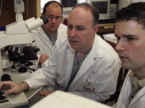 Dr. Lawrence Rosenberg (middle) is conducting diabetes experiments in his lab at Montreal General Hospital.