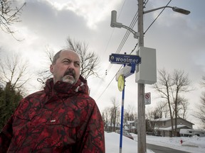 MONTREAL, QUE.: MARCH 7, 2015 -- Yves Hamelin stands under a Rogers cell antenna installed a few months ago very near to his home in Pointe Claire Saturday, March 7, 2015. (Peter McCabe / MONTREAL GAZETTE)