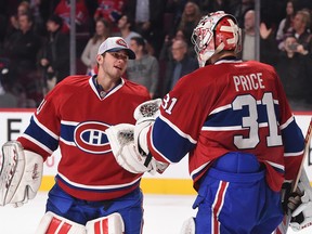 Canadiens goalie Dustin Tokarski (left) congratulates Carey Price after the latter's Nov. 11, 2014, Bell Centre win over Winnipeg.