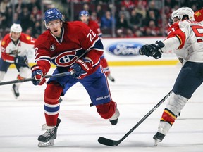 Dale Weise skates past Brian Campbell of the Florida Panthers at the Bell Centre on Thursday, Feb, 19, 2015.