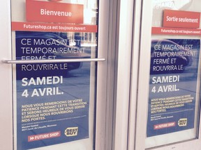A poster on the door of the Future Shop on St. Catherine St. W. near Phillips Square in Montreal, March 28, 2015.
