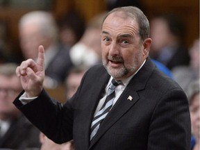 Infrastructure Minister Denis Lebel responds to a question during question period in the House of Commons on Parliament Hill in Ottawa on Tuesday, Feb. 3, 2015.