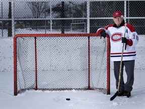 Montreal Canadiens legend Elmer Lach stands at a goal net on a Pointe-Claire rink near his home on his 92nd birthday in 2010.