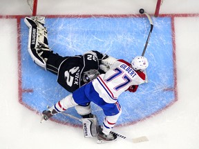 Canadiens defenceman Tom Gilbert tucks the puck behind Los Angeles Kings goalie Jonathan Quick at the Staples Centre on March 5, 2015, in Los Angeles. The goal was reminiscent, in some ways, of Boston legend Bobby Orr's Stanley Cup-winning goal in 1970.