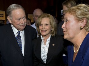 Former Quebec premier Jacques Parizeau and his wife, Lisette Lapointe, are greeted by then-Parti Quebecois leader Pauline Marois (right) as he arrives at the Monument National for the launch of his new book. Parizeau died last night at the age of 84.