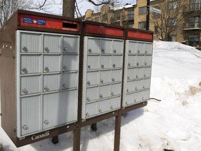 A community mailbox is seen in the east end of Montreal Thursday, March 5, 2015. Police are investigating a series of robberies on letter carriers by thieves who have been taking the carriers keys to community and apartment mailboxes.