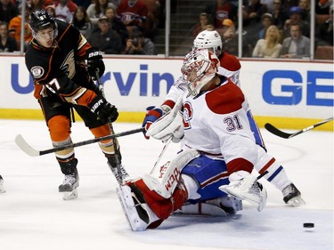 Anaheim Ducks center Rickard Rakell scores past Montreal Canadiens goalie Carey Price during the second period of an NHL hockey game in Anaheim, Calif., Wednesday, March 4, 2015.