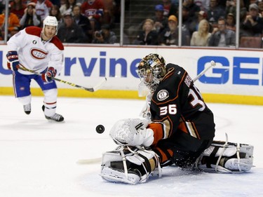 Anaheim Ducks goalie John Gibson, right, blocks a shot by Montreal Canadiens right wing Brandon Prust during the first period of an NHL hockey game in Anaheim, Calif., Wednesday, March 4, 2015.