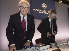 André Desmarais, Deputy Chairman, President, and Co-Chief Executive Officer of Power Corporation, and Co-Chairman of Power Financial, and Paul Desmarais Jr., Chairman and Co-Chief Executive Officer of Power Corporation and Co-Chairman of Power Financial, right, are shown at the Power Financial Corp. annual meeting in Montreal Thursday, May 15, 2014.