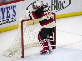 Ottawa Senators goalie Andrew Hammond stands in his crease after allowing the New York Rangers' fifth goal during game in Ottawa on March 26, 2015. The Rangers won 5-1.