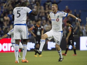The Impact's Bakary Soumare, left, and Calum Mallace celebrate their 1-1 tie against Pachuca FC in CONCACAF soccer action on March 3, 2015 at Montreal's Olympic Stadium.