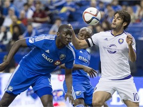 Montreal Impact's Bakary Soumare, left, and Orlando City SC's Kaka battle for the ball during first half MLS action Saturday, March 28, 2015, in Montreal.