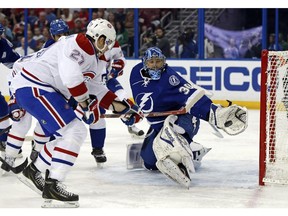 Tampa Bay Lightning goalie Ben Bishop makes a save on Montreal Canadiens' Alex Galchenyuk during the first period Monday, March 16, 2015, in Tampa, Fla.