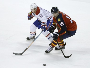 Montreal Canadiens right wing Brendan Gallagher (11) and Florida Panthers centre Aleksander Barkov (16) chase the puck during the third period Tuesday, March 17, 2015,  in Sunrise, Fla.