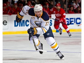 Torrey Mitchell (#17) of the Buffalo Sabres skates up ice during a NHL game against the Detroit Red Wings on January 18, 2015 at Joe Louis Arena in Detroit, Michigan. The Wings defeated the Sabres 6-4.