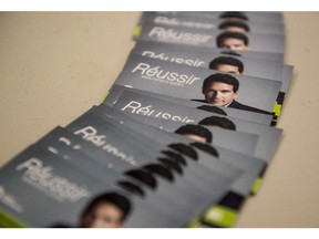 Campaign cards for PQ leadership candidate Pierre Karl Peladeau are seen at the first leadership debate Wednesday, March 11, 2015 in Trois-Rivieres, Que.