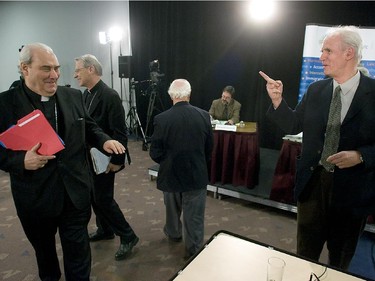 Cardinal Jean Claude Turcotte shares a laugh with Claude Taylor of  the Bouchard-Taylor Commission in Montreal on December 12, 2007.