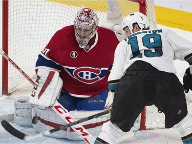 Montreal Canadiens goaltender Carey Price makes a save on San Jose Sharks' Joe Thornton during first period NHL hockey action in Montreal, Saturday, March 21, 2015.