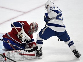 Carey Price stops Tampa Bay Lightning right wing Ryan Callahan during second-period action at the Bell Centre on Tuesday, March 10, 2015.