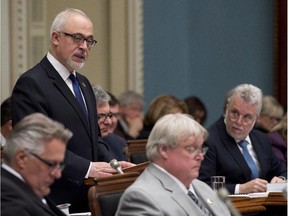 Quebec Finance Minister Carlos Leitao presents a provincial budget as Premier Philippe Couillard, right, looks on, Thursday, March 26, 2015 at the legislature in Quebec City.