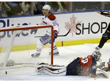 The puck gets past Florida Panthers goalie Dan Ellis on a goal scored by Montreal Canadiens left wing Jacob De La Rose  during the second period Tuesday, March 17, 2015,  in Sunrise, Fla.