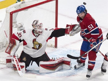 Ottawa Senators goalie Andrew Hammond deflects a shot past David Desharnais at the Bell Centre on Thursday, March 12, 2015.