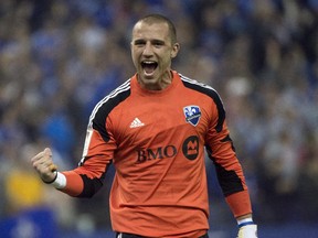Montreal Impact goalkeeper Evan Bush celebrates his team's 1-1 tie against Pachuca in CONCACAF Champions League game on March 3, 2015 at Montreal's Olympic Stadium.